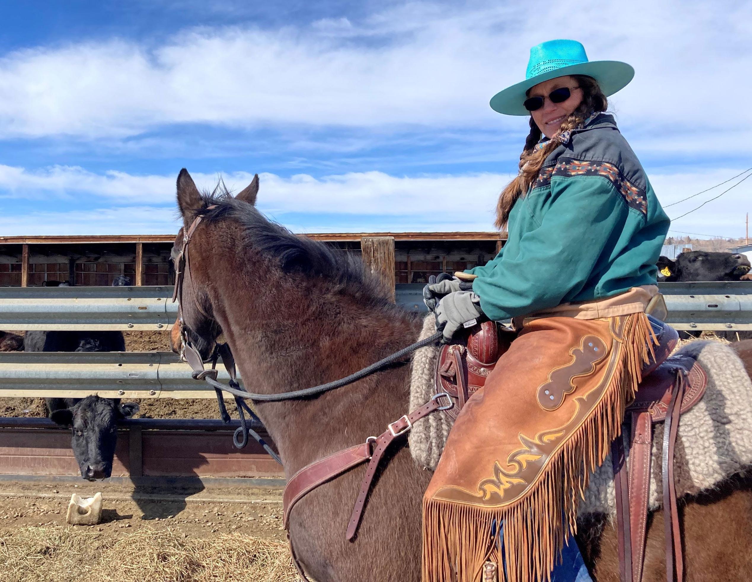 Photo of Debbie Kister on a horse